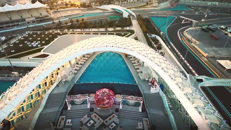 Aerial view of the rooftop pool with the circuit wrapped around the hotel