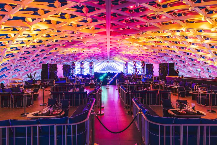 The After Party club under a ceiling of pink and orange light